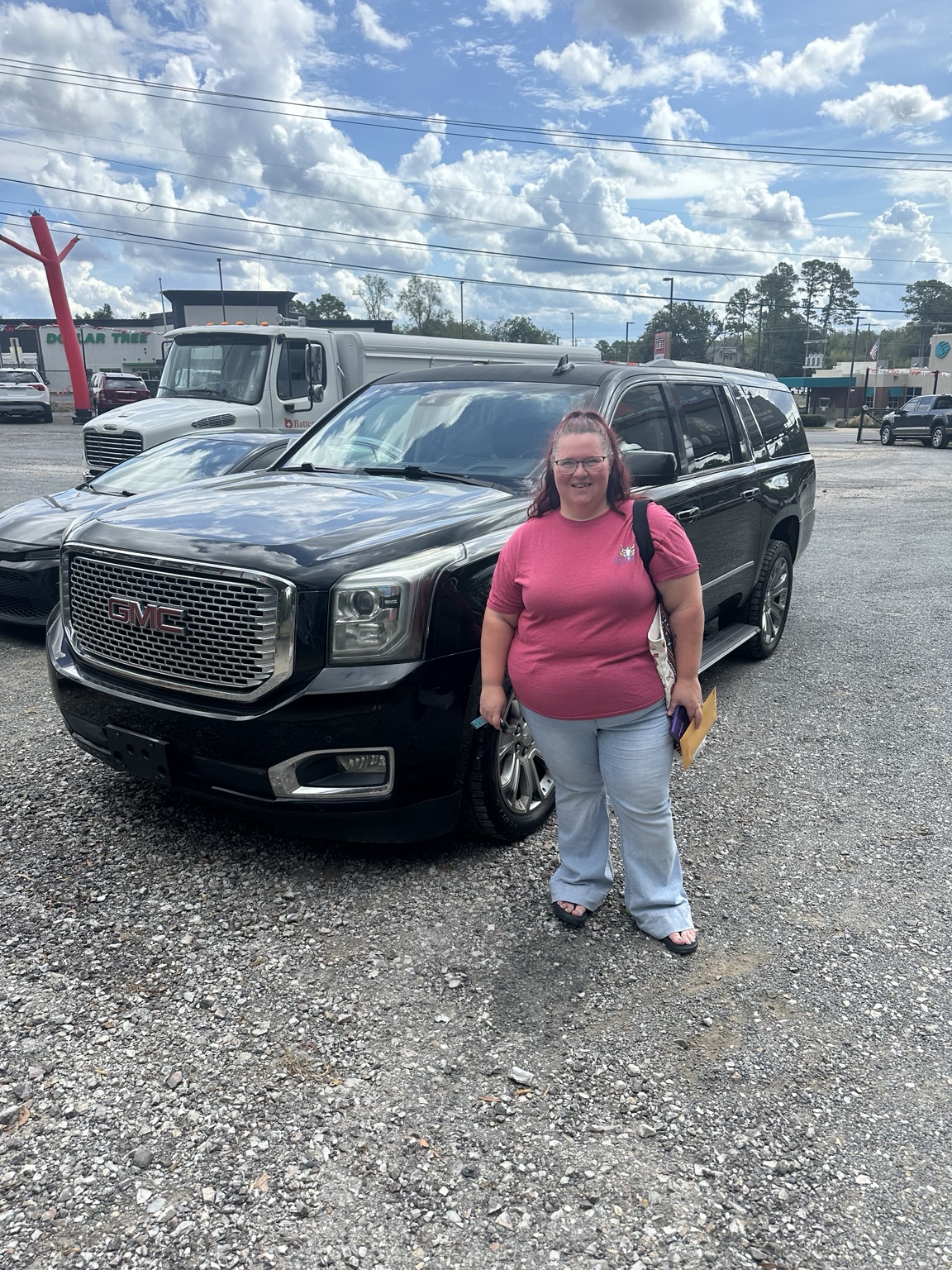 Mica with their 2015 GMC Yukon XL Denali purchased from TMT Motors