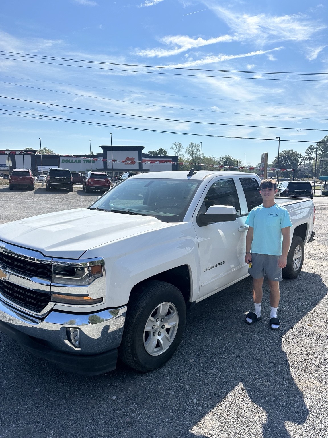 Michael with their 2017 Chevrolet Silverado 1500 LT purchased from TMT Motors