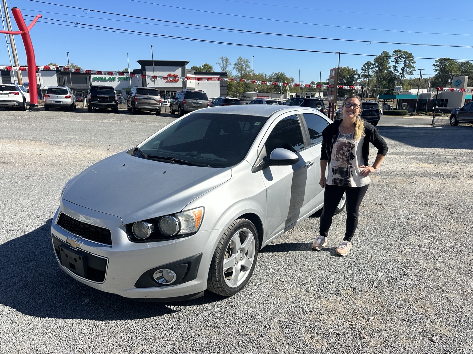 Stephanie with their 2016 Chevrolet Sonic LTZ purchased from TMT Motors
