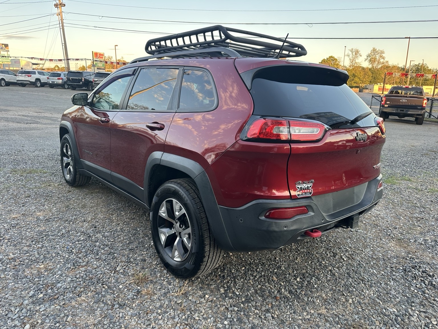 Red 2015 Jeep Cherokee Trailhawk front exterior view