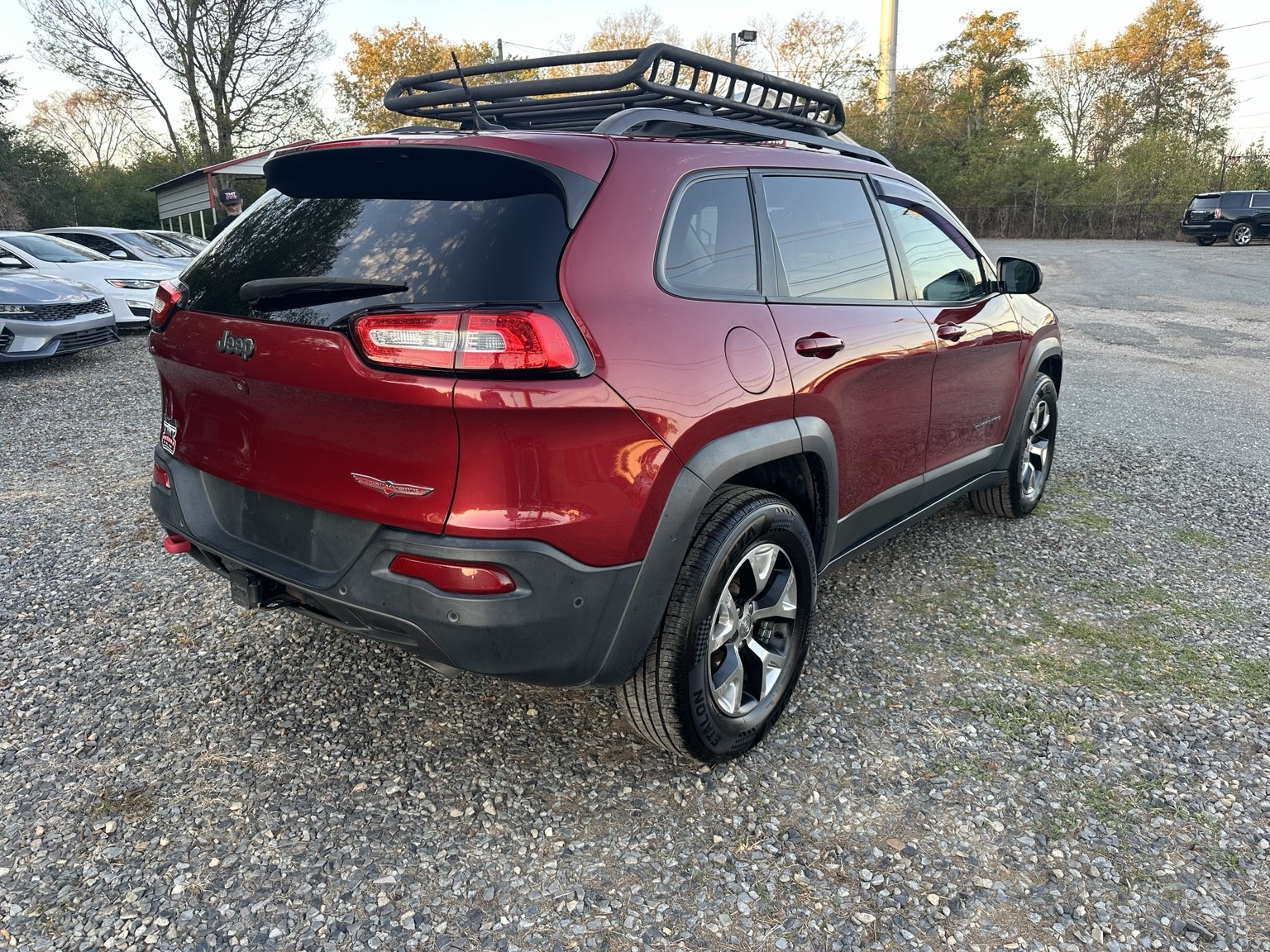 Red 2015 Jeep Cherokee Trailhawk side exterior view