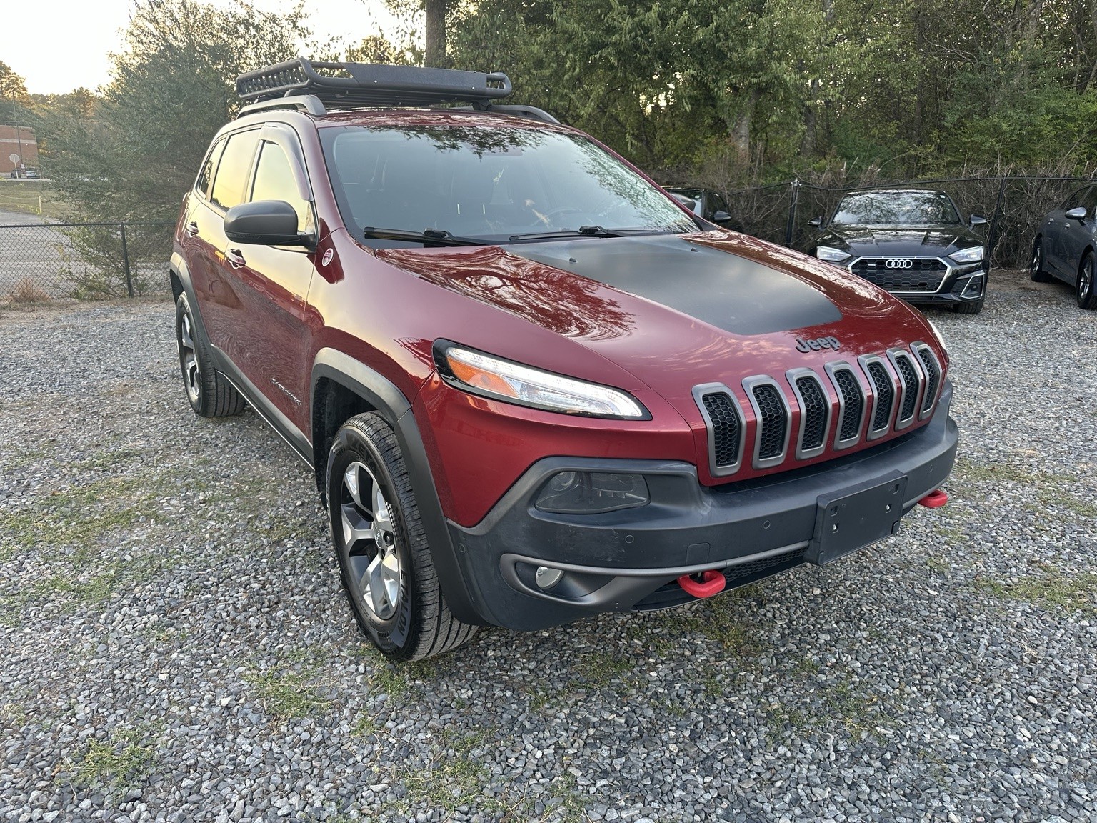 Red 2015 Jeep Cherokee Trailhawk rear exterior view