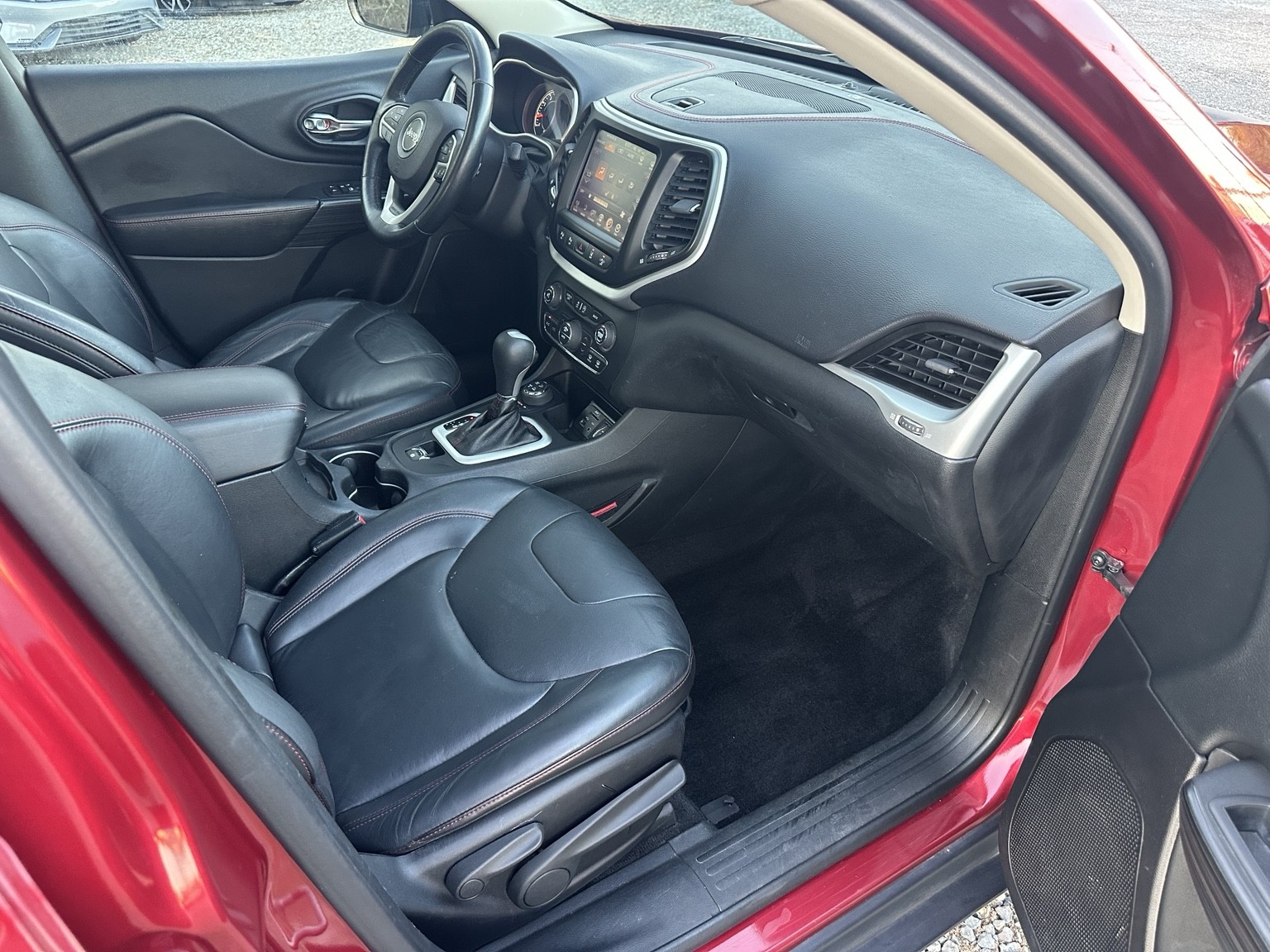 Red 2015 Jeep Cherokee Trailhawk cargo area