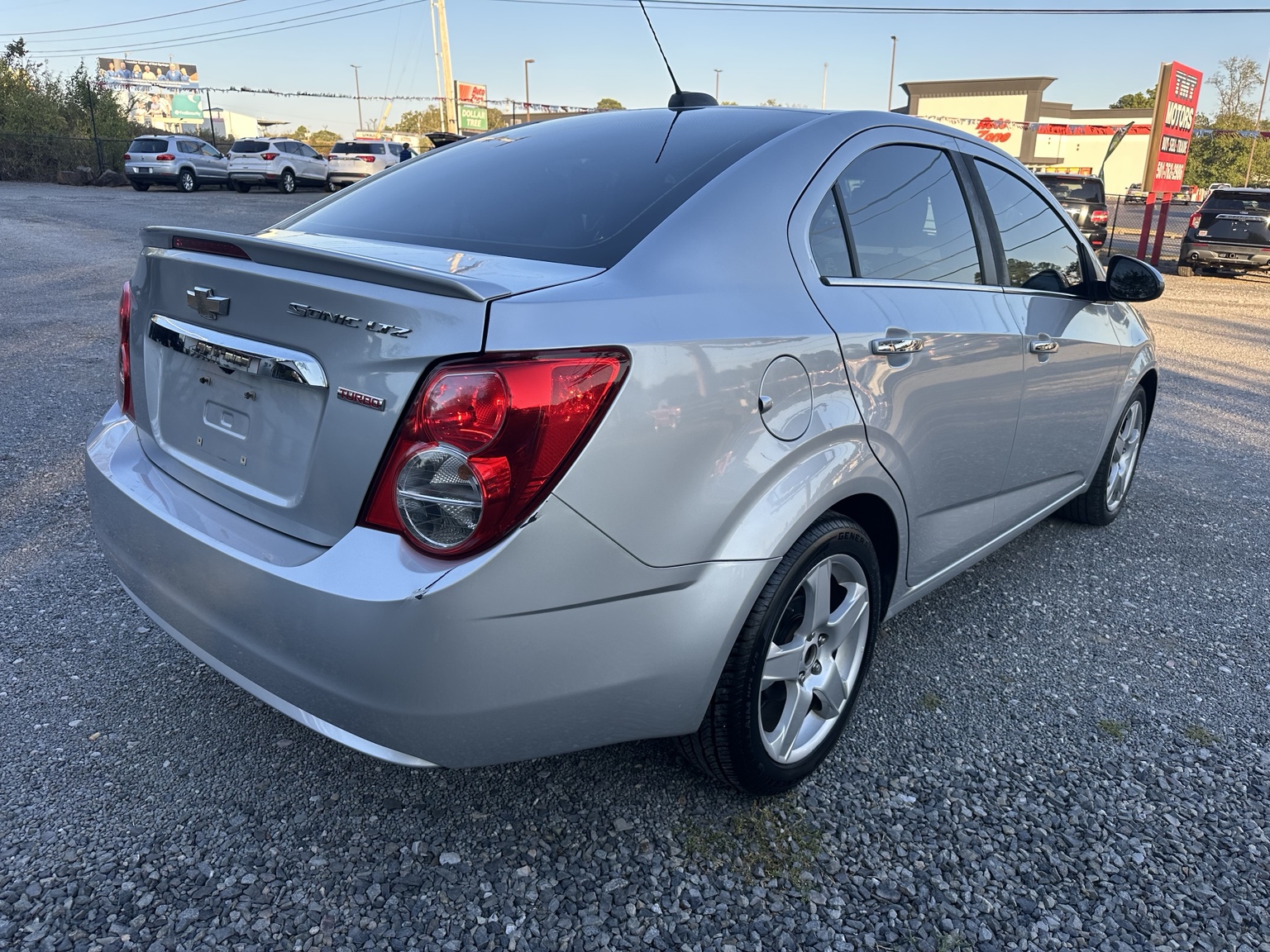 Silver 2016 Chevrolet Sonic LTZ side exterior view