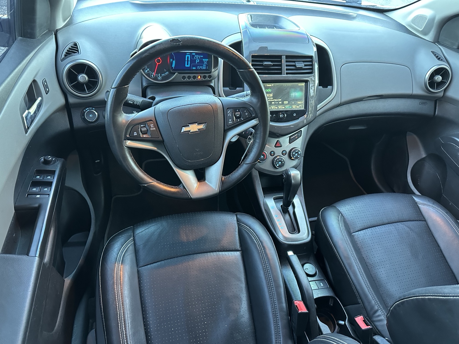 Silver 2016 Chevrolet Sonic LTZ engine compartment