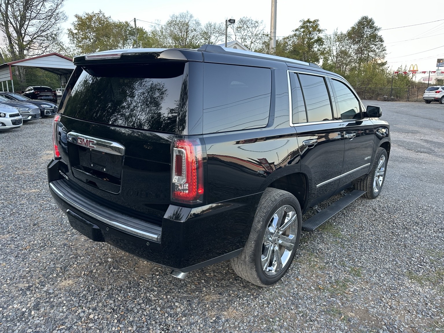 Black 2017 GMC Yukon Denali side exterior view