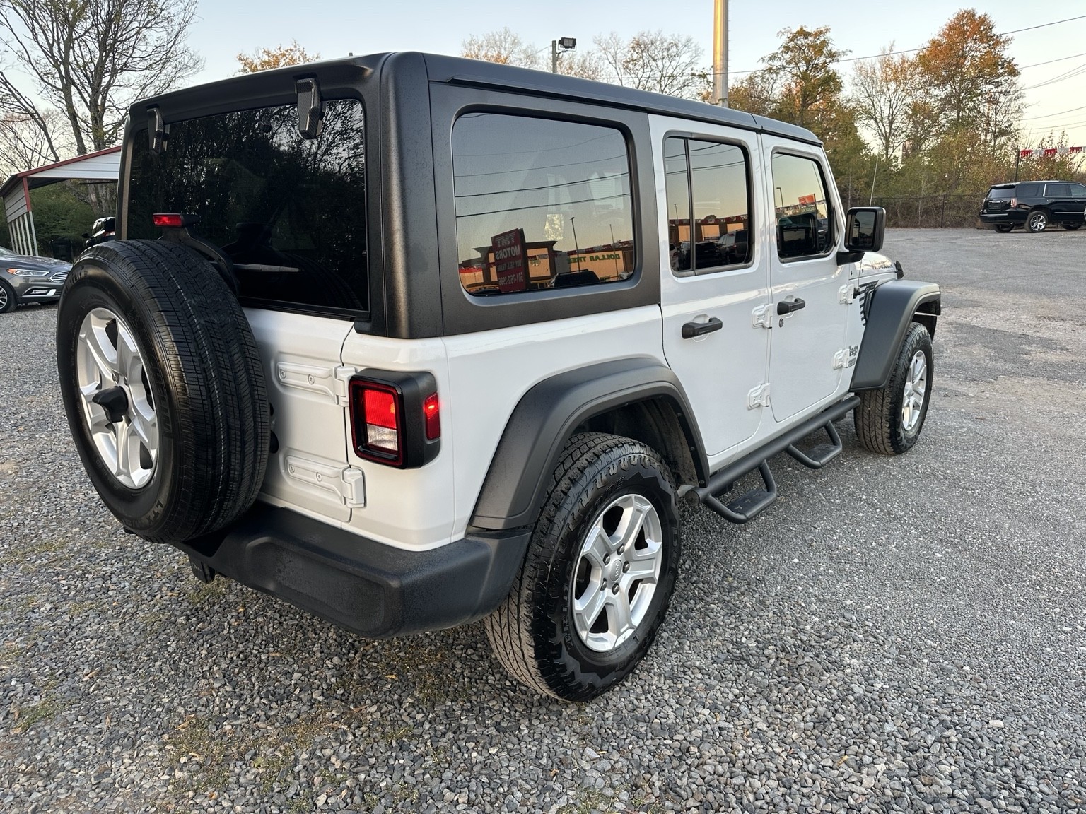 White 2020 Jeep Wrangler Sport side exterior view