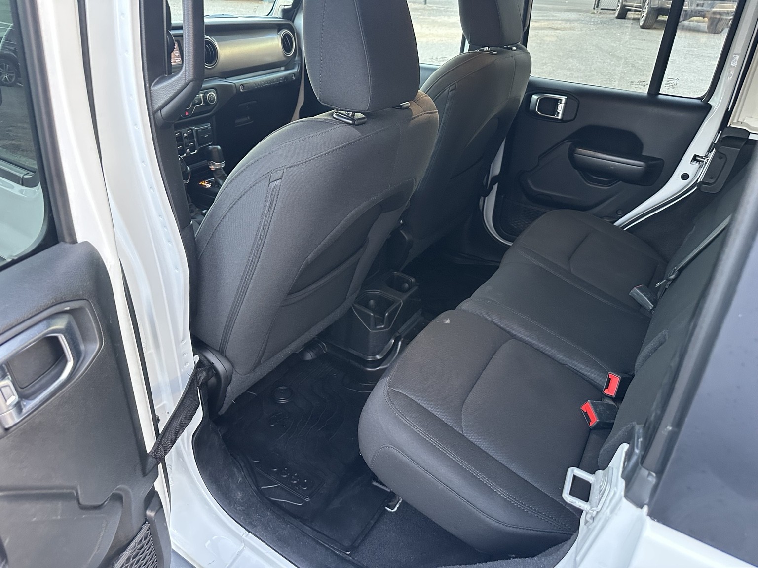 White 2020 Jeep Wrangler Sport dashboard and controls