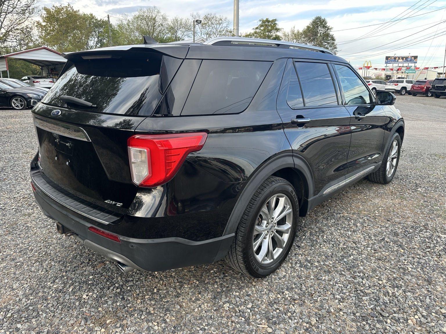 Black 2021 Ford Explorer Limited side exterior view